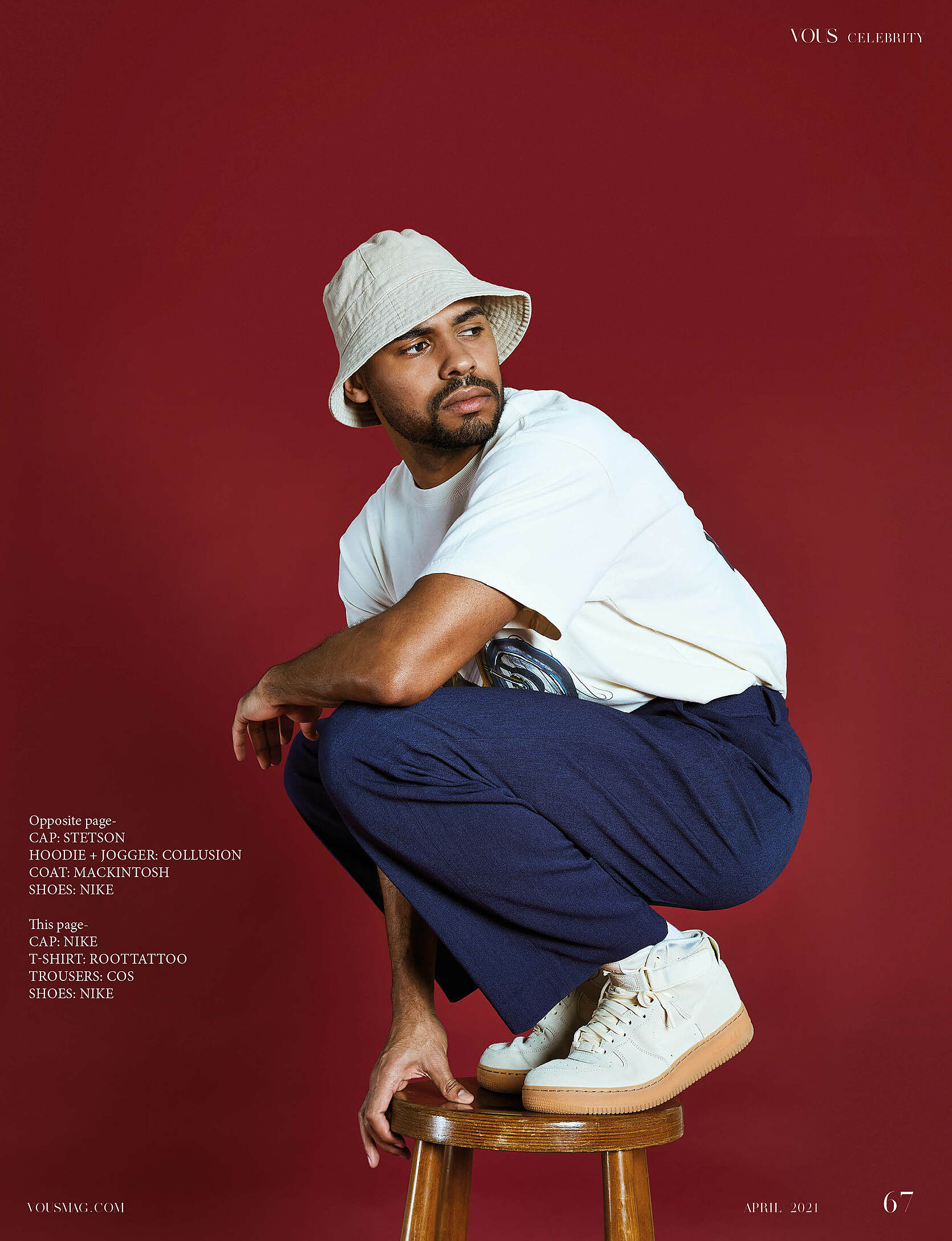 A male model with a white T-shirt, a beige hat and blue trousers